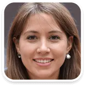 Smiling woman with straight, shoulder-length brown hair, wearing pearl earrings and a light complexion, looking directly at the camera.